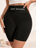 Black Mid-Thigh Shaper Shorts with Slogan Waist